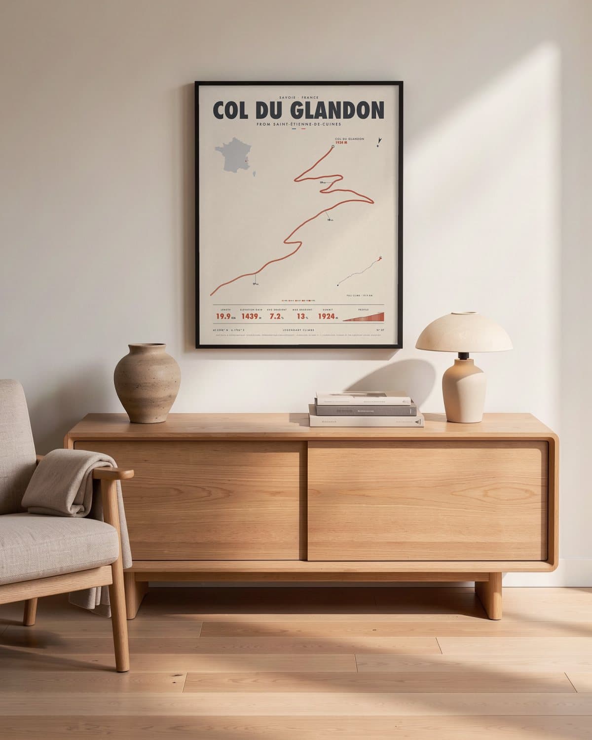 Col du Glandon cycling climb poster in a black frame (45 × 60 cm) in a living room