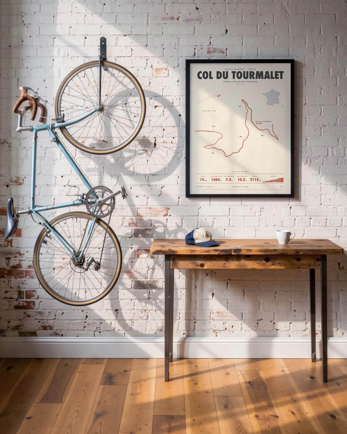 Col du Tourmalet cycling climb poster in a black frame (45 × 60 cm) in a brick loft with a vintage bike