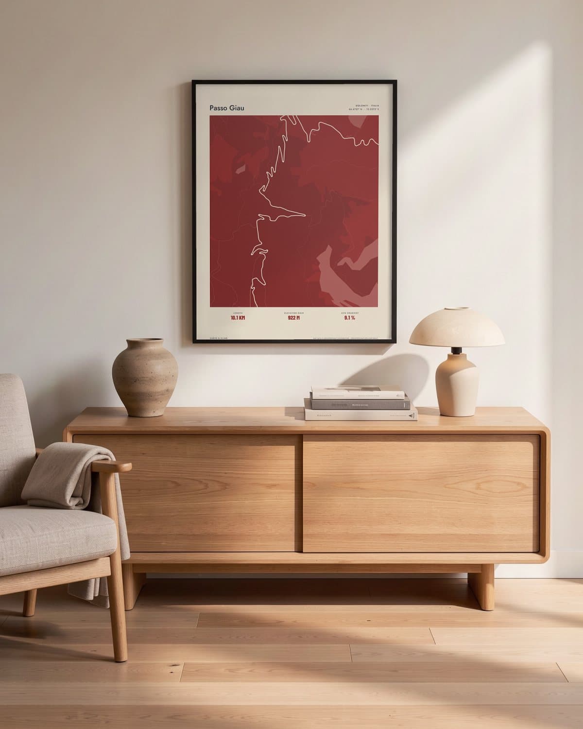 Passo Giau Atlas Deep Red map poster in a black frame (45 × 60 cm) in a living room