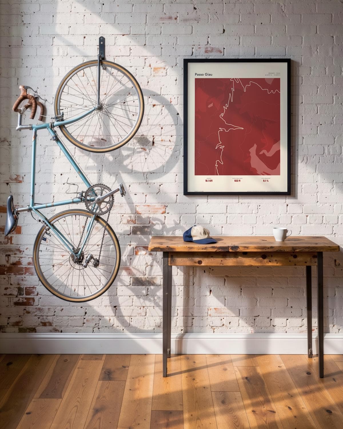 Passo Giau Atlas Deep Red map poster in a black frame (45 × 60 cm) in a brick loft with a vintage bike