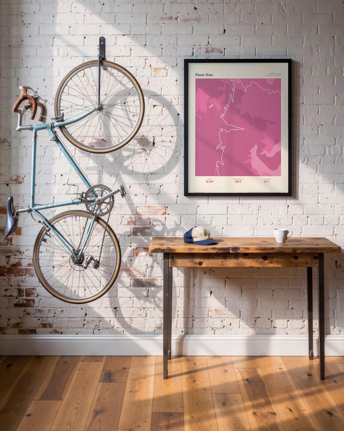 Passo Giau Atlas Pink map poster in a black frame (45 × 60 cm) in a brick loft with a vintage bike