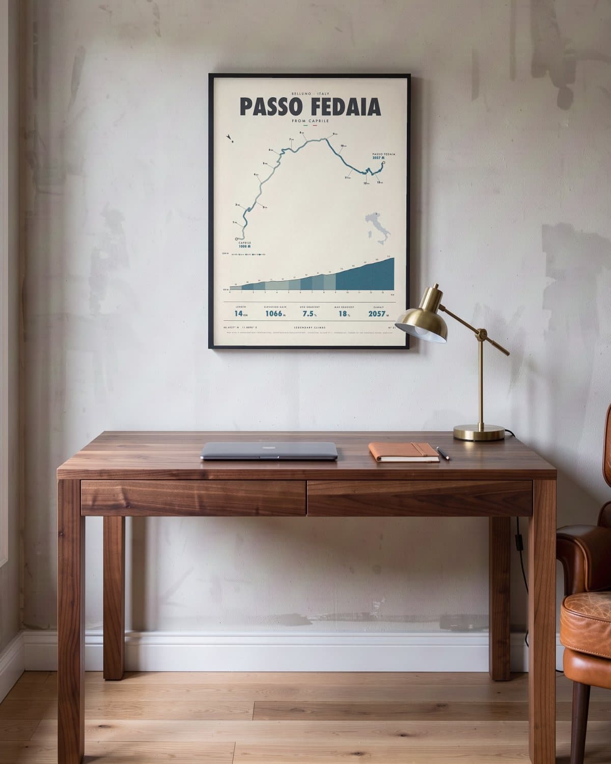 Passo Fedaia cycling climb poster in a black frame (45 × 60 cm) in a home office