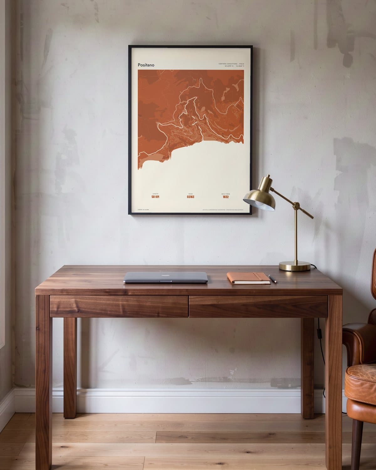 Positano Atlas Burnt Orange kaartposter in een zwarte lijst (45 × 60 cm) in een werkkamer