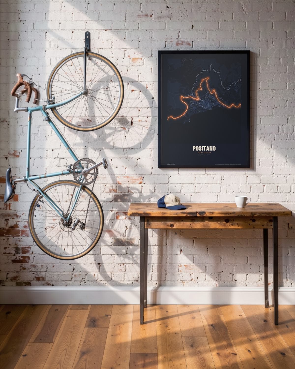 Positano Night Session map poster in a black frame (45 × 60 cm) in a brick loft with a vintage bike