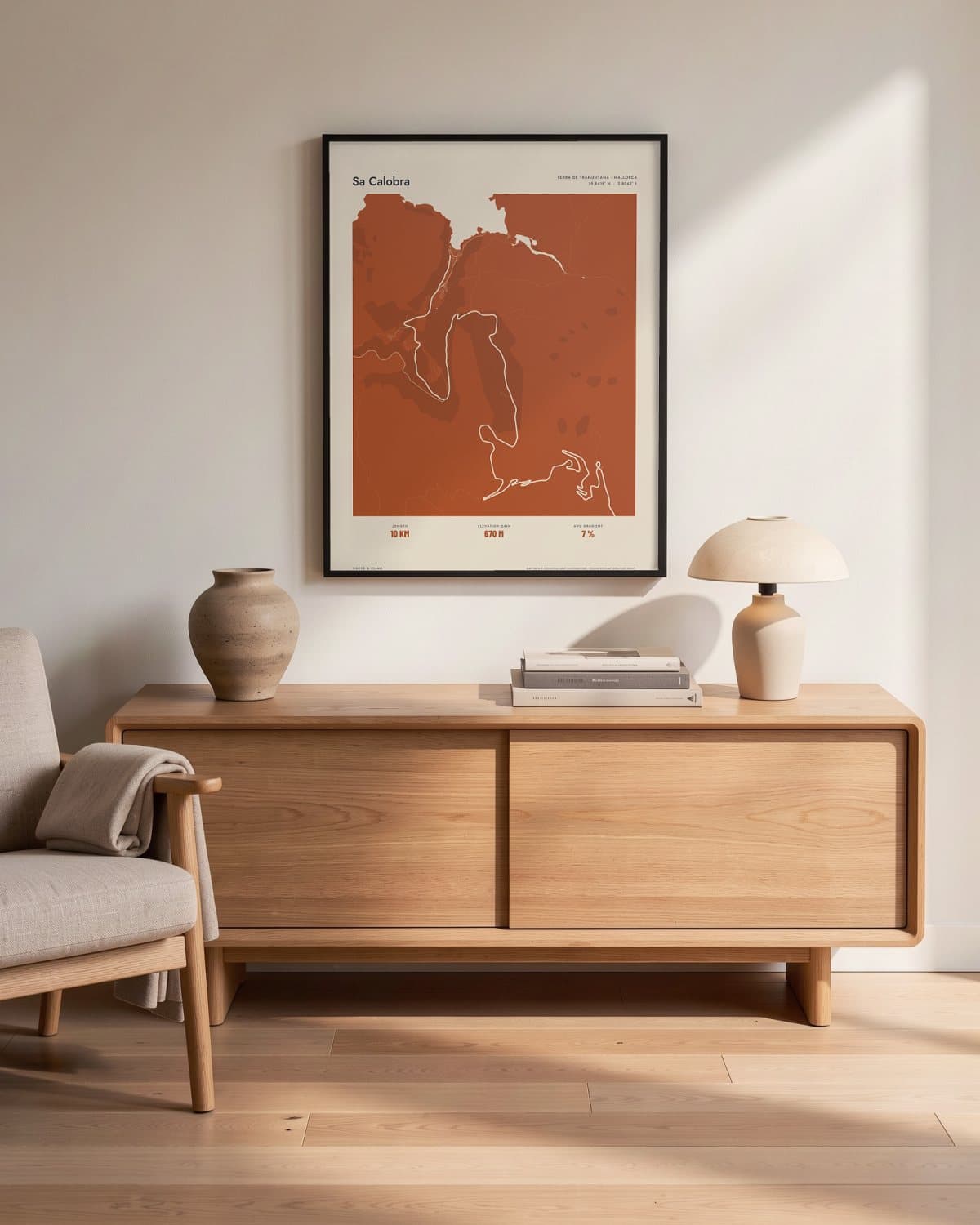 Sa Calobra Atlas Burnt Orange map poster in a black frame (45 × 60 cm) in a living room