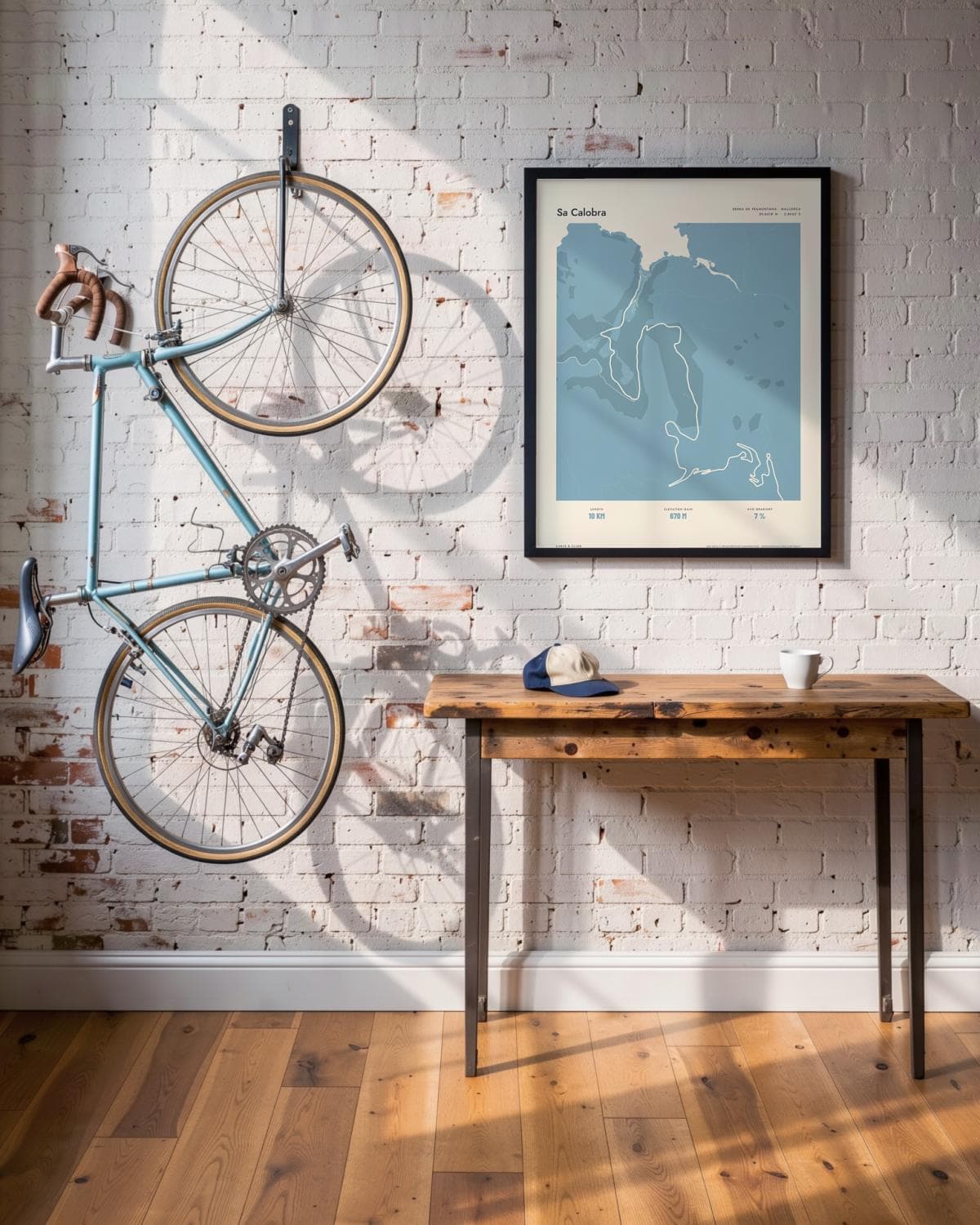 Sa Calobra Atlas Dusky Blue map poster in a black frame (45 × 60 cm) in a brick loft with a vintage bike