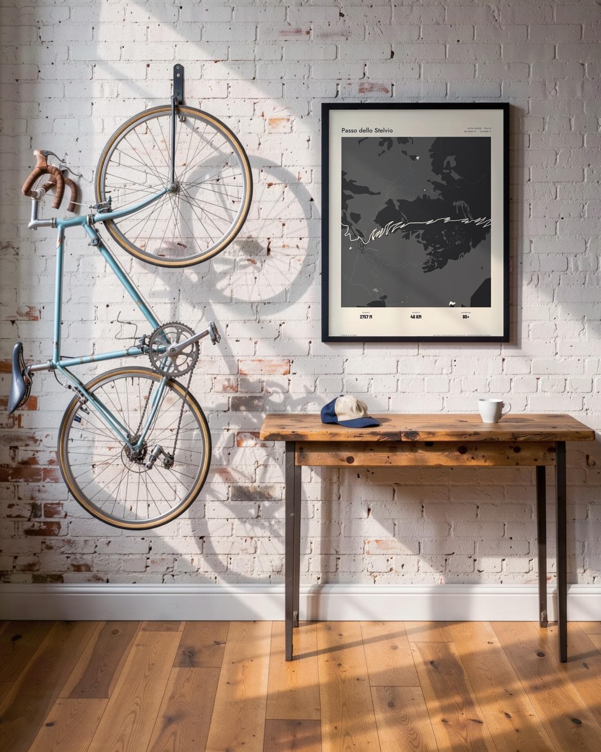 Passo dello Stelvio Atlas Black map poster in a black frame (45 × 60 cm) in a brick loft with a vintage bike