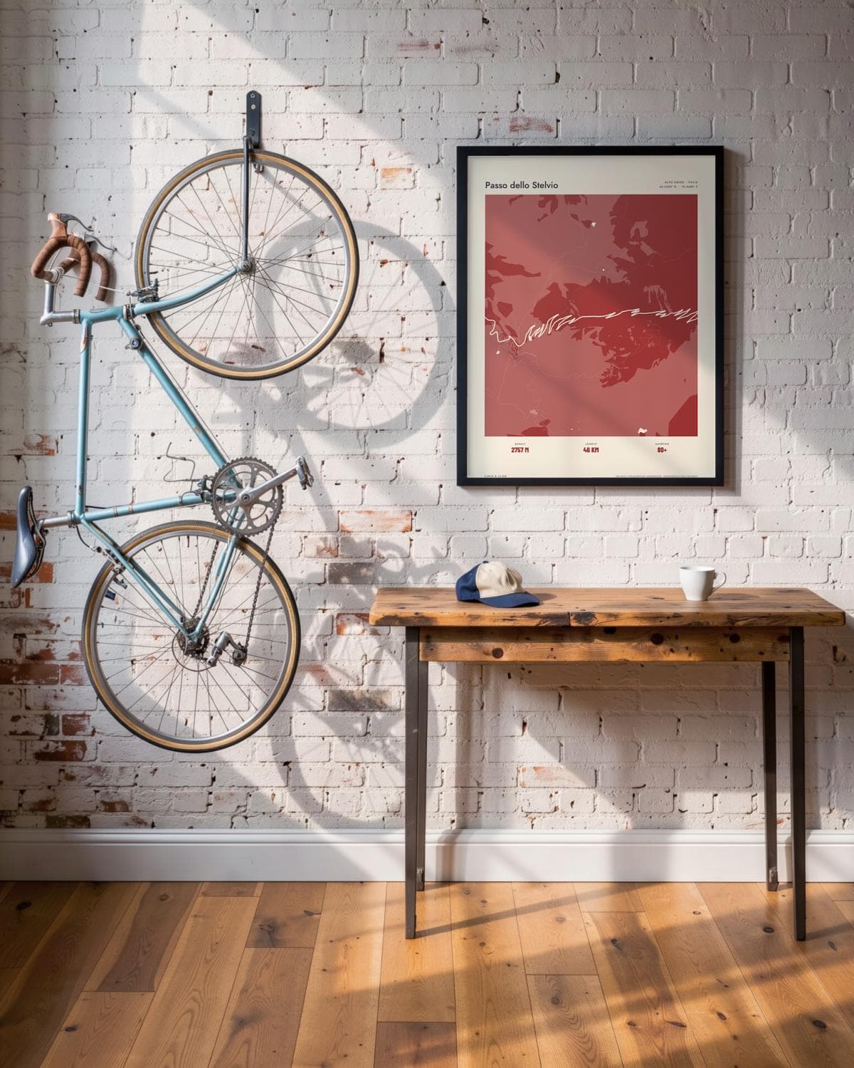 Passo dello Stelvio Atlas Deep Red map poster in a black frame (45 × 60 cm) in a brick loft with a vintage bike