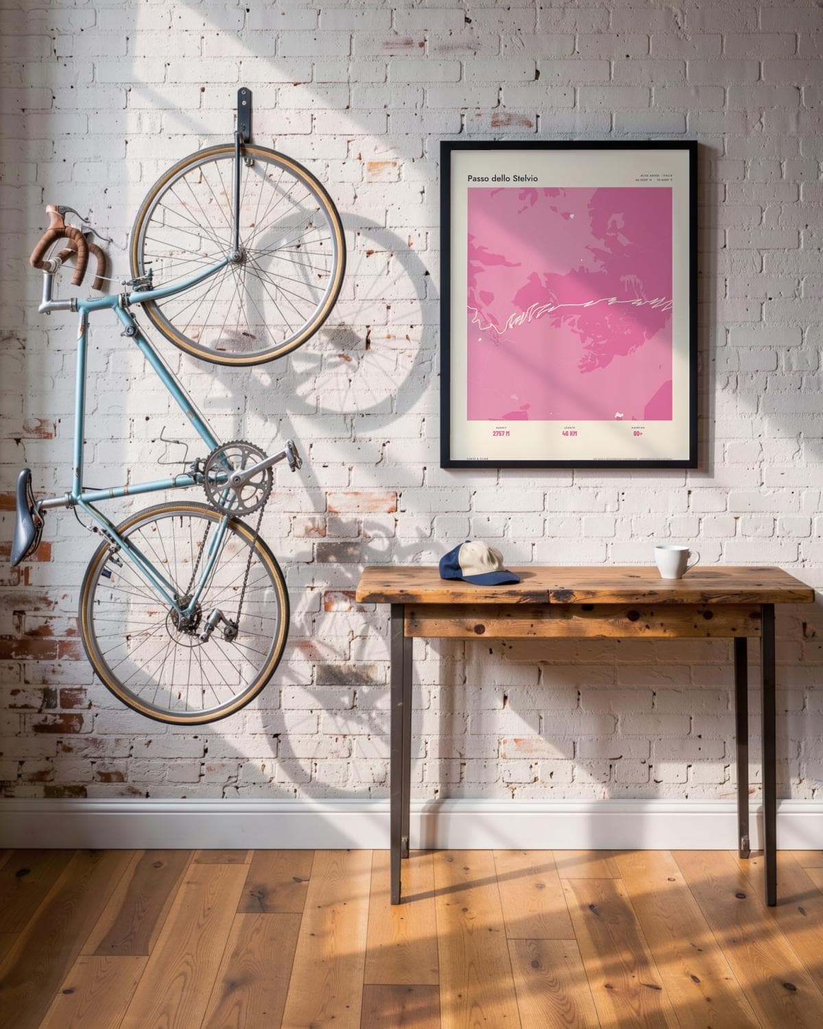 Passo dello Stelvio Atlas Pink map poster in a black frame (45 × 60 cm) in a brick loft with a vintage bike