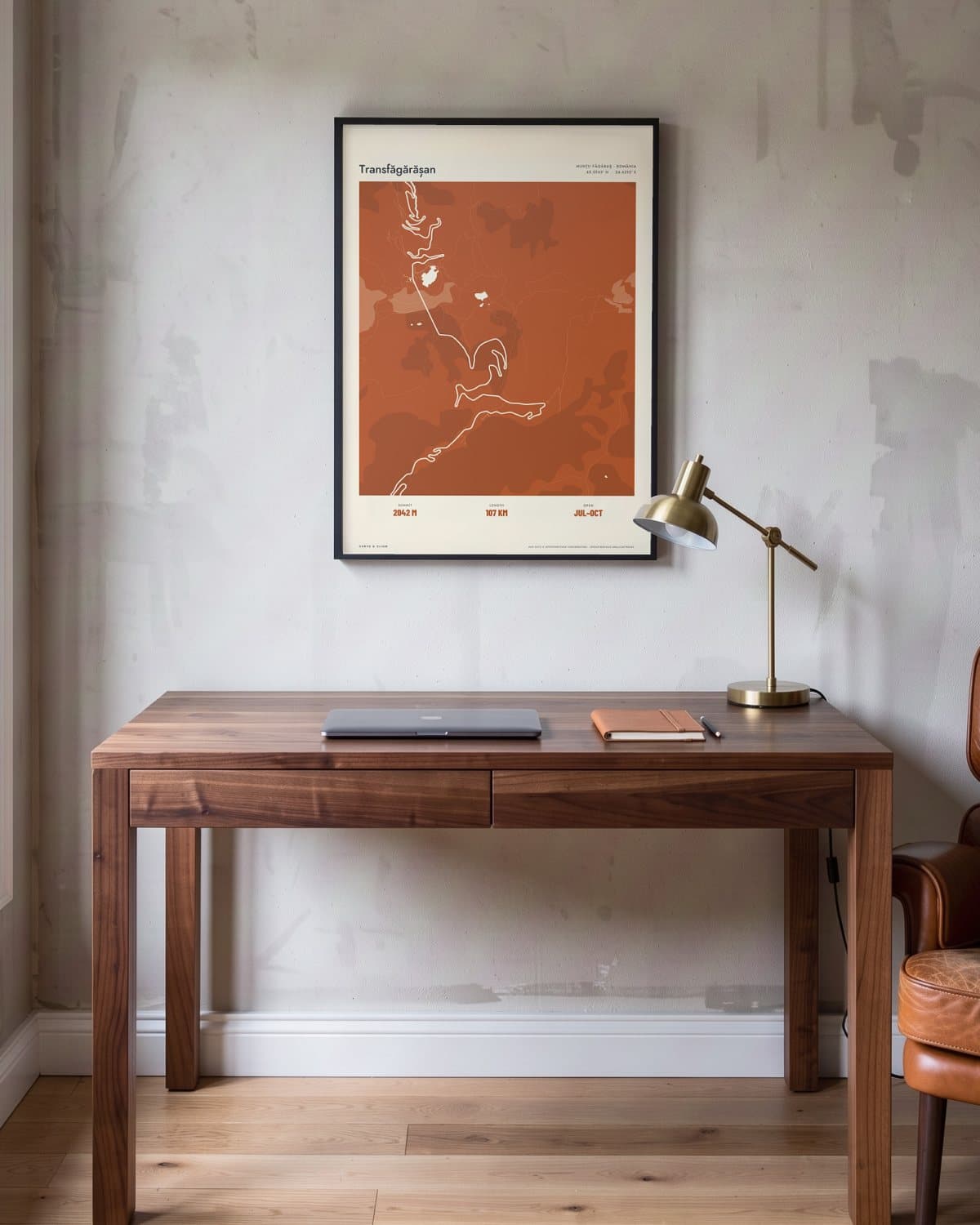 Transfăgărășan Atlas Burnt Orange map poster in a black frame (45 × 60 cm) in a home office