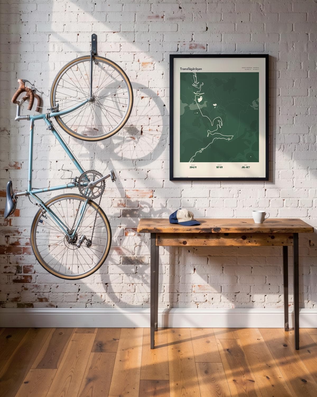 Transfăgărășan Atlas Forest map poster in a black frame (45 × 60 cm) in a brick loft with a vintage bike