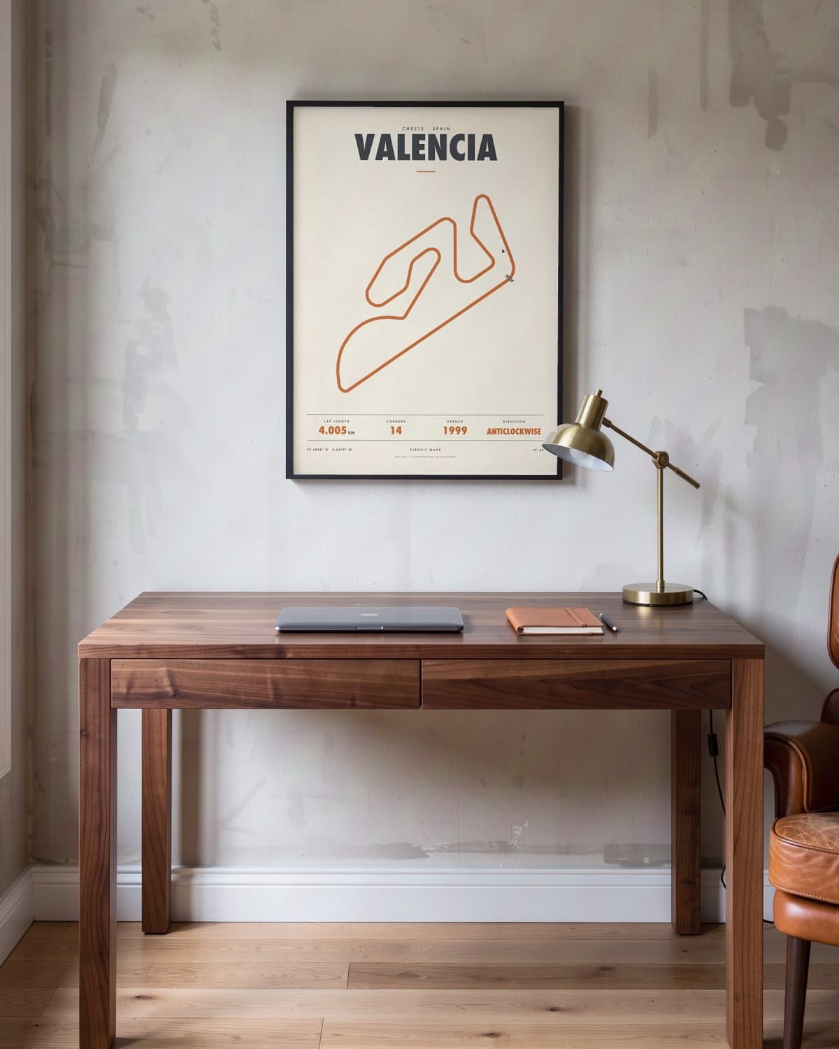 Valencia circuit poster in a black frame (45 × 60 cm) in a home office