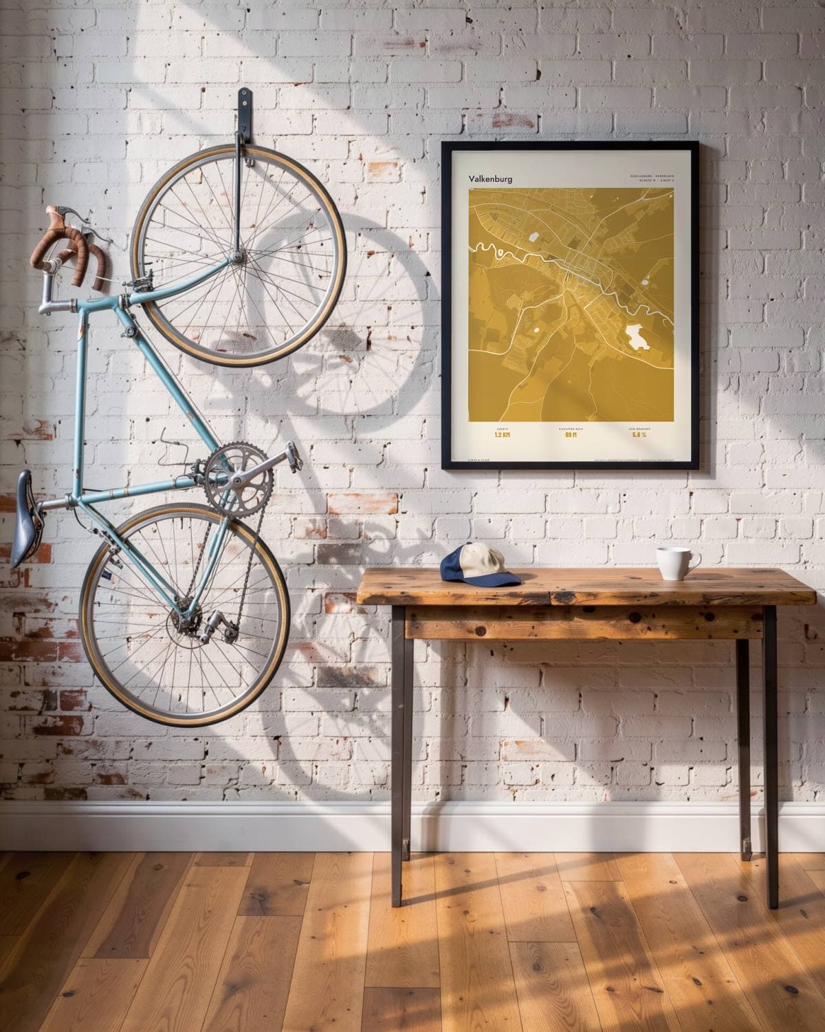 Valkenburg Atlas Mustard map poster in a black frame (45 × 60 cm) in a brick loft with a vintage bike