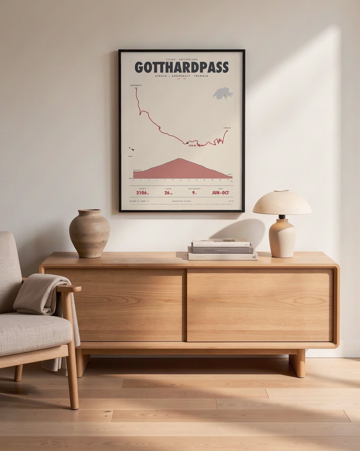 Gotthardpass mountain pass poster in a black frame (45 × 60 cm) in a living room