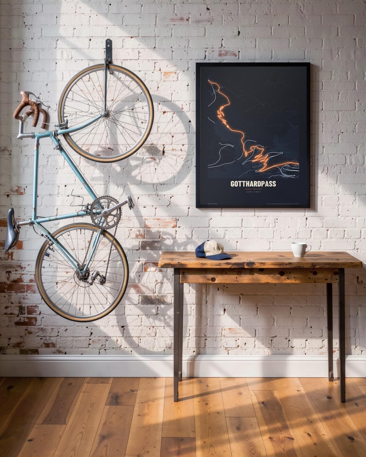 Gotthardpass Night Session map poster in a black frame (45 × 60 cm) in a brick loft with a vintage bike