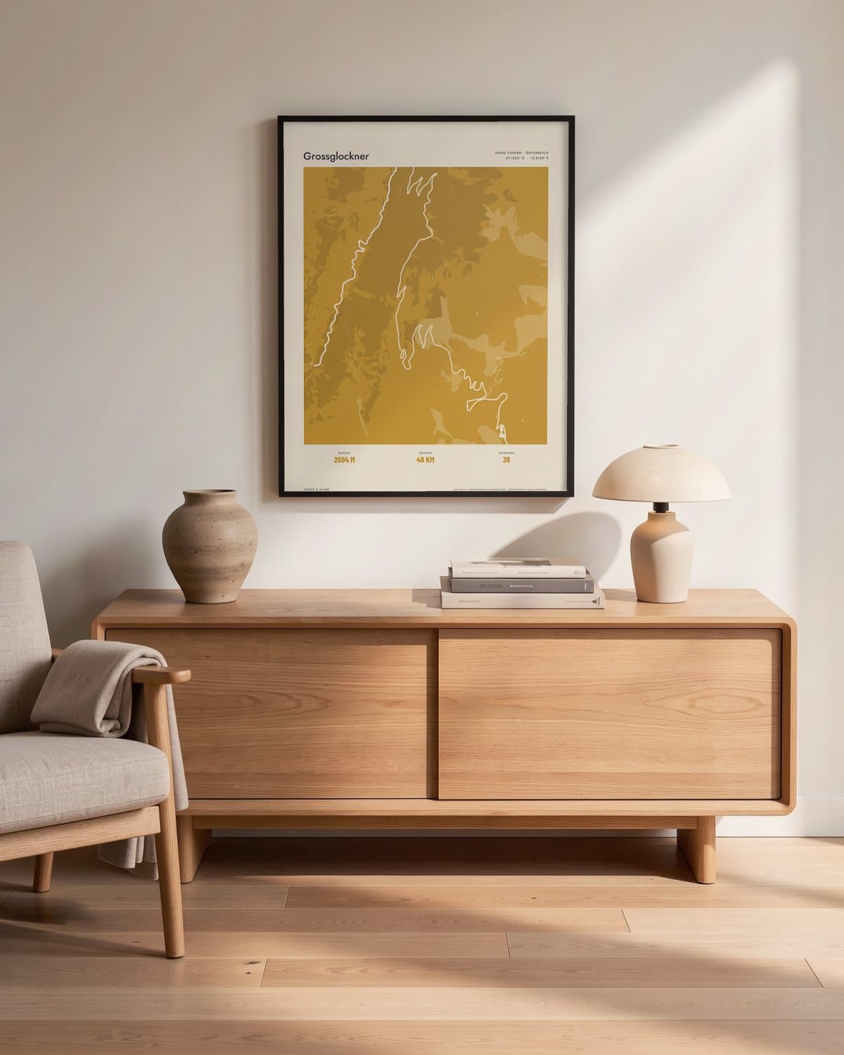 Grossglockner Atlas Mustard map poster in a black frame (45 × 60 cm) in a living room