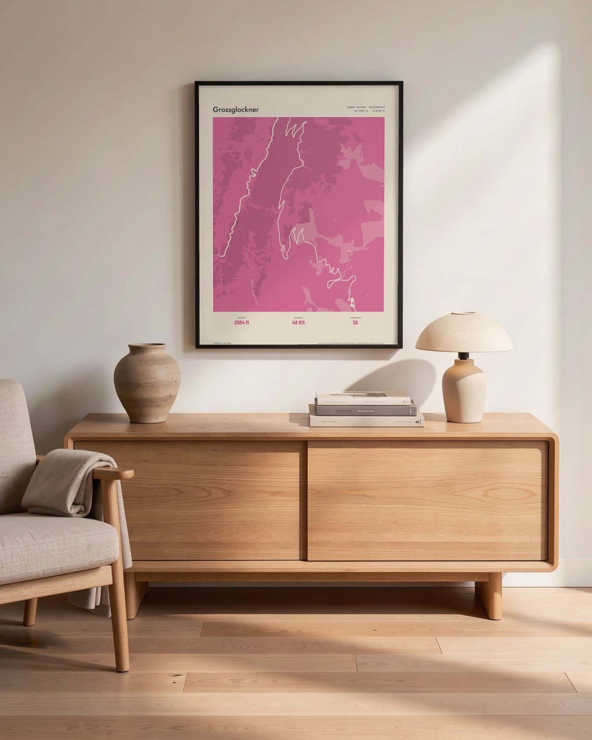 Grossglockner Atlas Pink map poster in a black frame (45 × 60 cm) in a living room