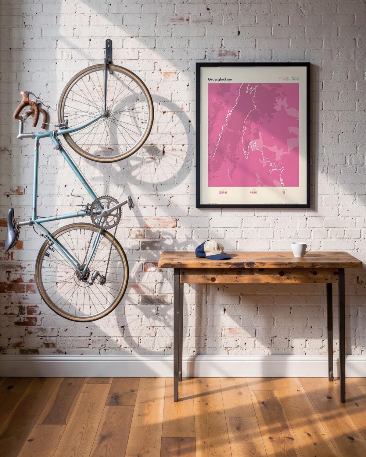 Grossglockner Atlas Pink map poster in a black frame (45 × 60 cm) in a brick loft with a vintage bike