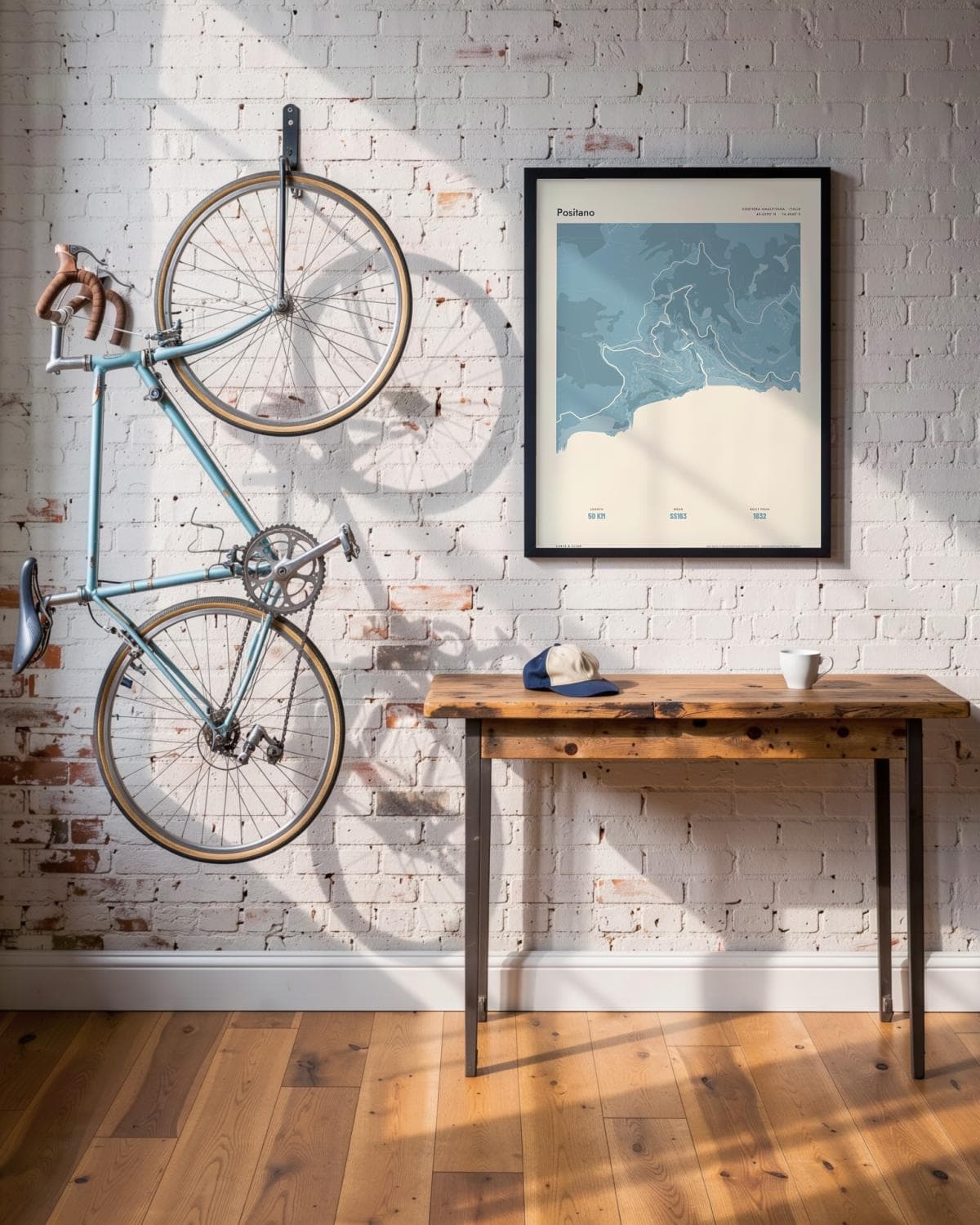 Positano Atlas Dusky Blue kaartposter in een zwarte lijst (45 × 60 cm) in een loft met een klassieke racefiets