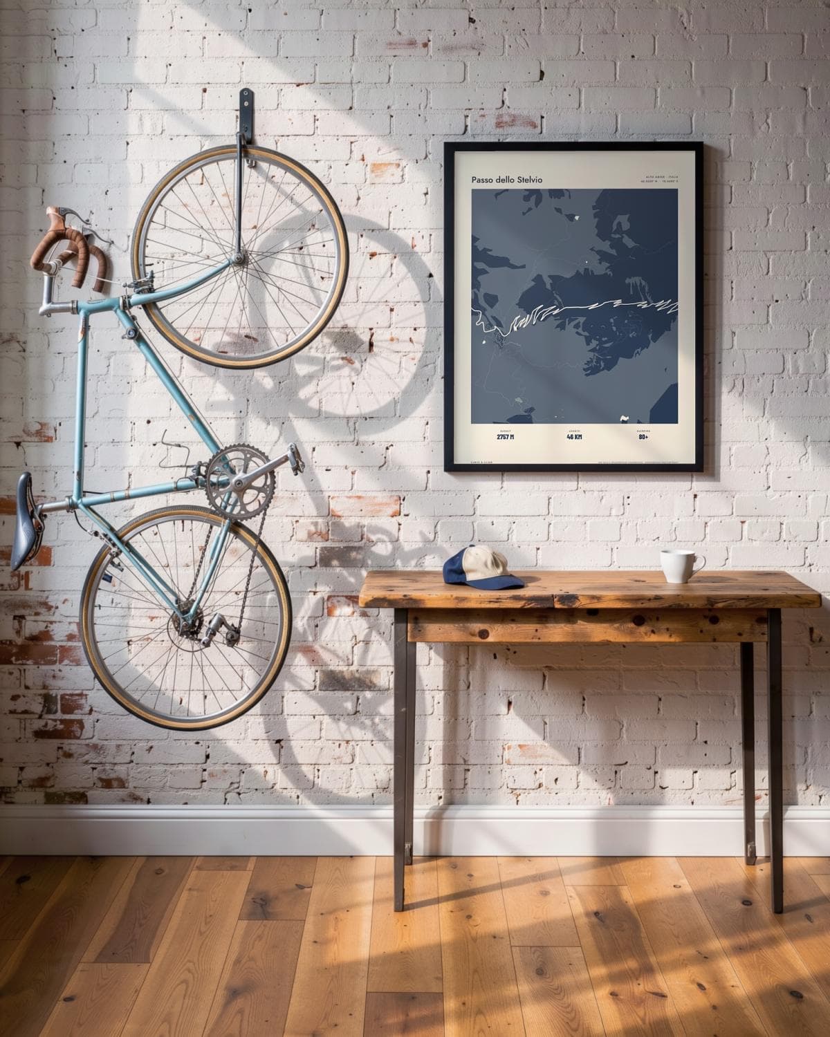 Passo dello Stelvio Atlas Navy map poster in a black frame (45 × 60 cm) in a brick loft with a vintage bike