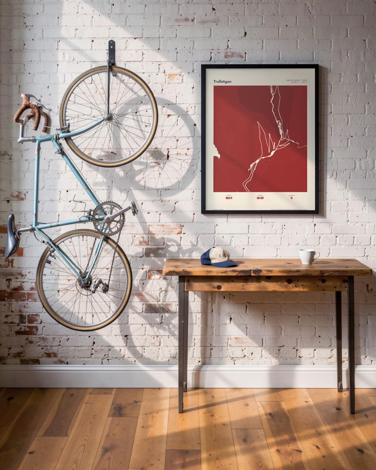 Trollstigen Atlas Deep Red map poster in a black frame (45 × 60 cm) in a brick loft with a vintage bike