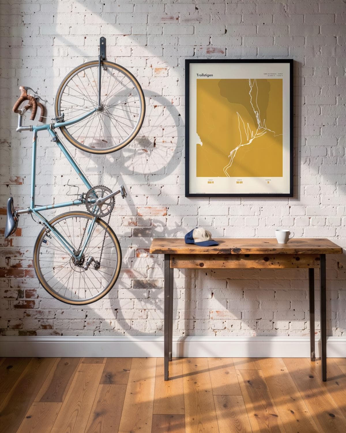 Trollstigen Atlas Mustard map poster in a black frame (45 × 60 cm) in a brick loft with a vintage bike